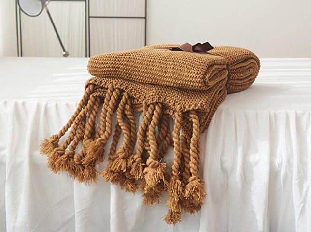 Knit blanket with discount tassels